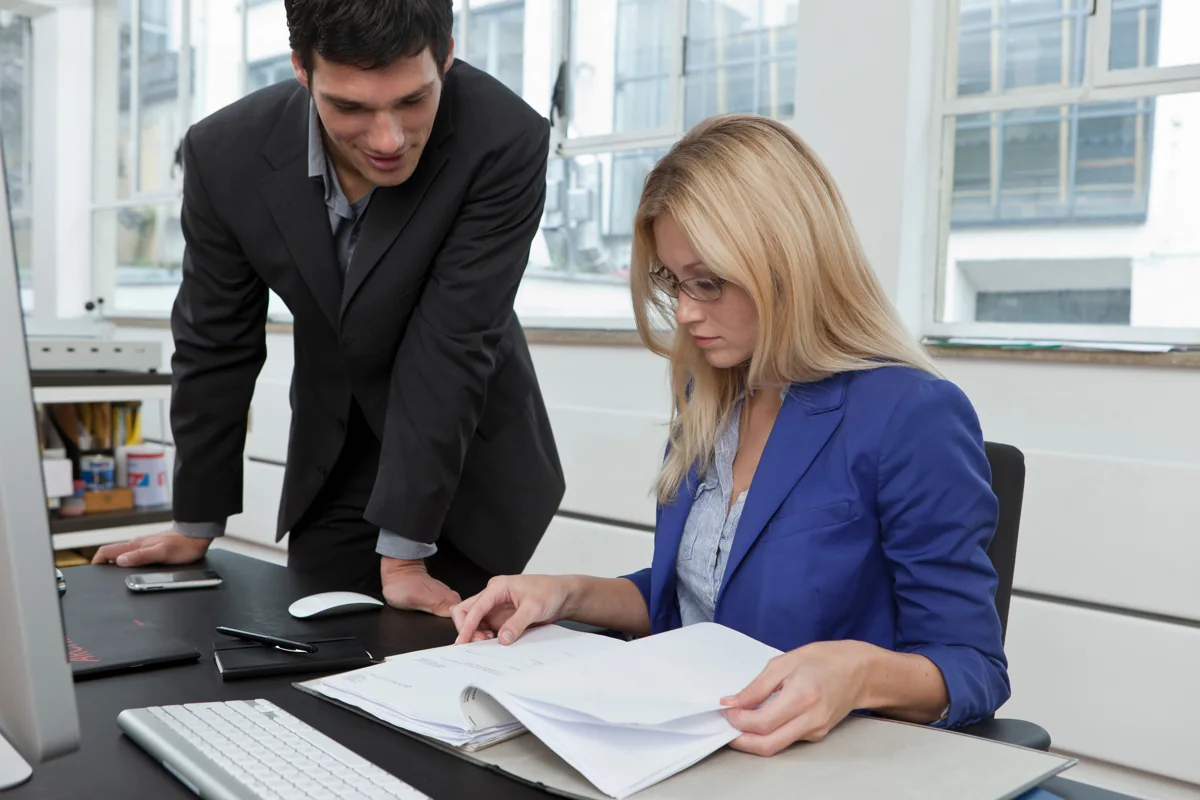 Professionals reviewing business information in an office